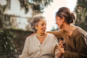 An old lady is receiving Nursing care from one of the staff of best NDIS service provider in Australia.