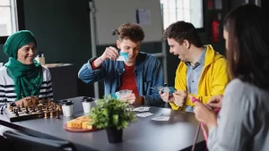 A group of people playing games, laughing and enjoying.